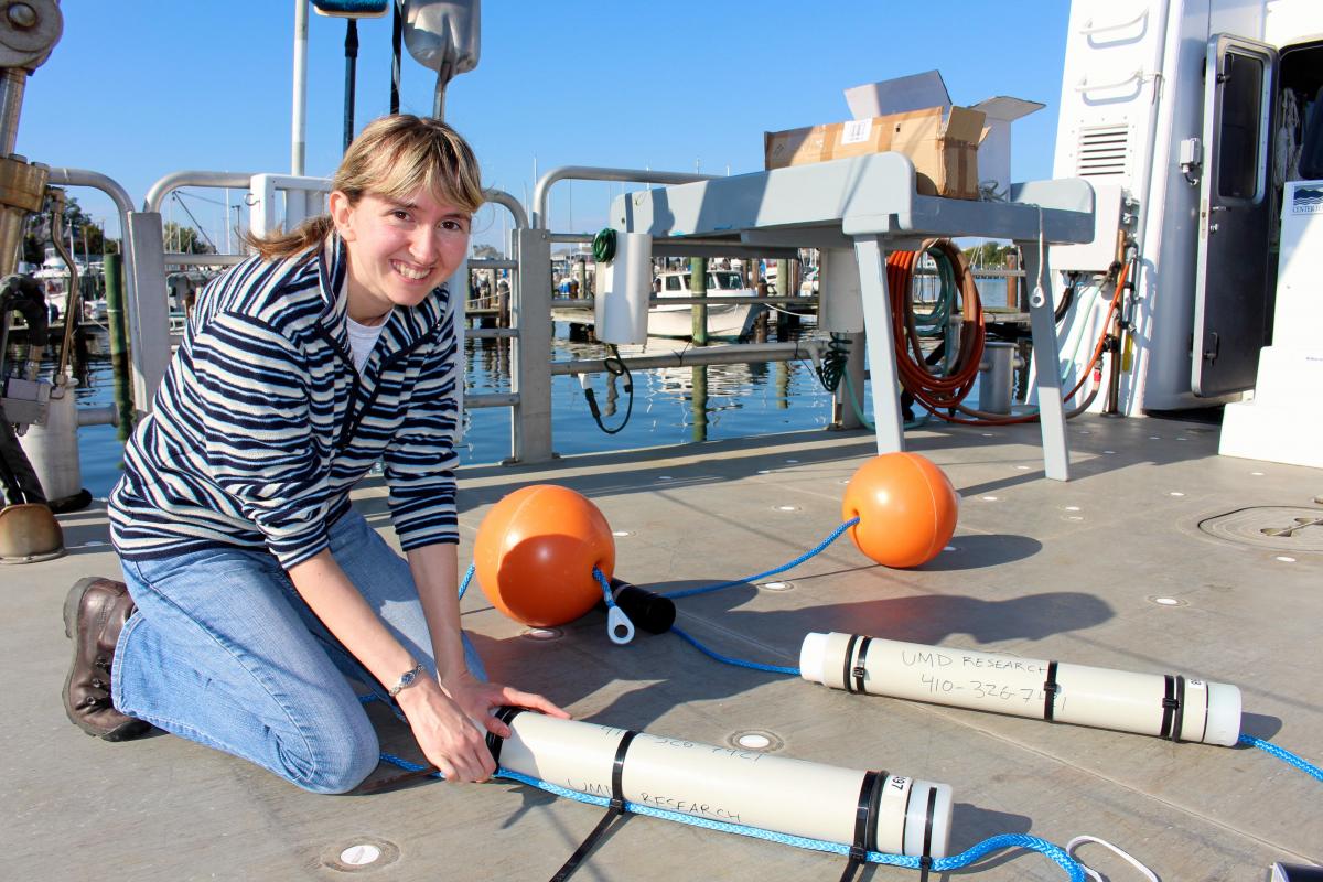 Woman setting up research instruments on docks