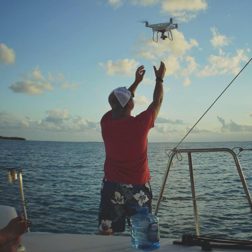 Man releasing drone from boat