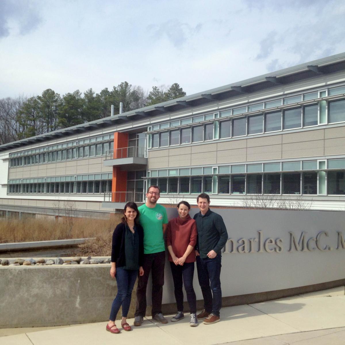 Four scientists in front of Mathias Lab building