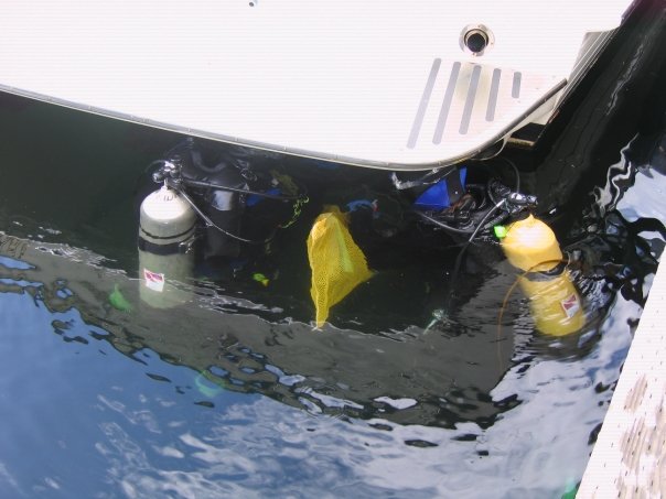 Research divers collecting samples from a small boat.