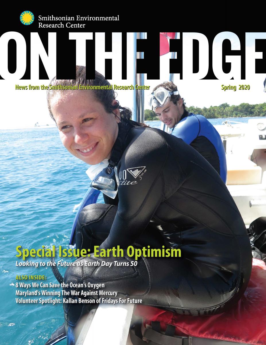 Front cover with woman on boat in diving suit