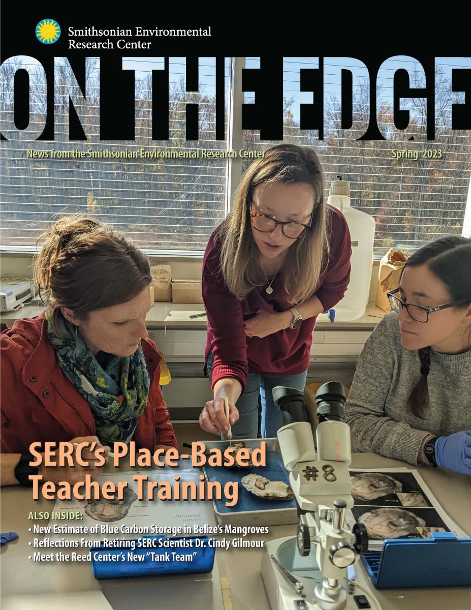 Front cover of spring 2023 On The Edge newsletter, showing three adults inspecting oysters in a lab