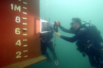 Greg Ruiz surveying a ship rudder