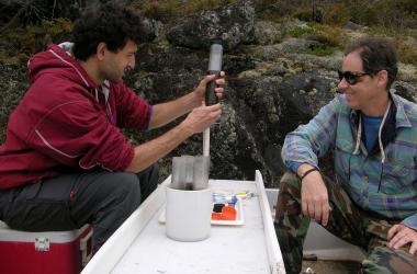 research about environmental pollution Scientists taking a sediment core for mercury analysis