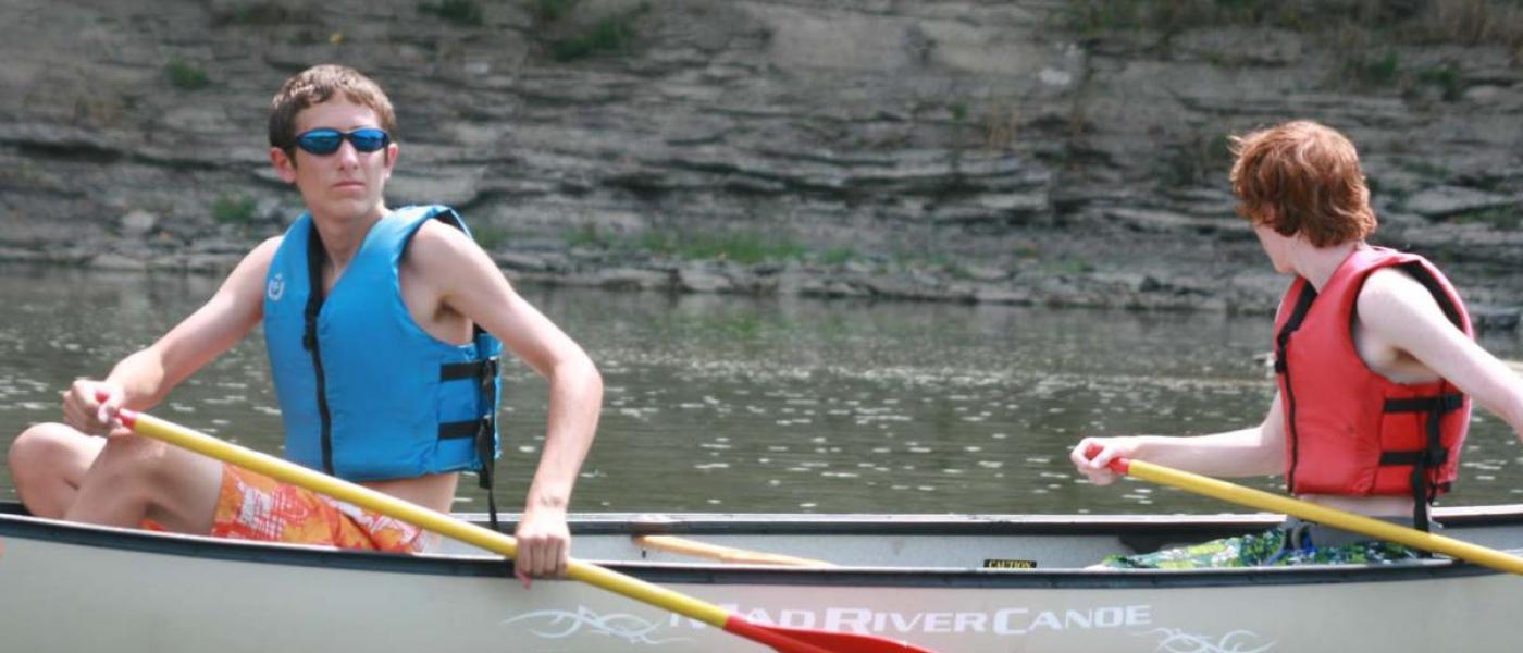 two boys canoeing