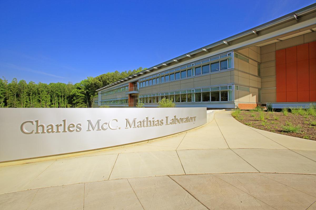 The front of the Charles McC. Mathias Laboratory building. There is a large silver-colored horizontal sign with large text that reads Charles McC. Mathias Laboratory.